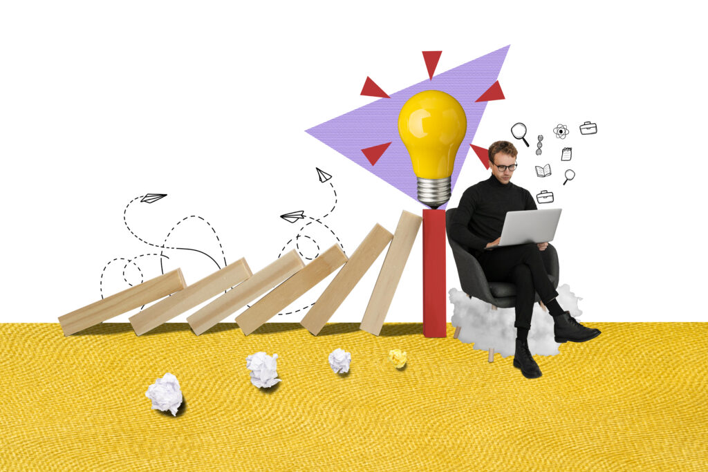 Man working on a laptop while sitting on a cloud, with a yellow lightbulb, domino wooden planks, paper planes, and doodles symbolizing ideas and problem-solving.